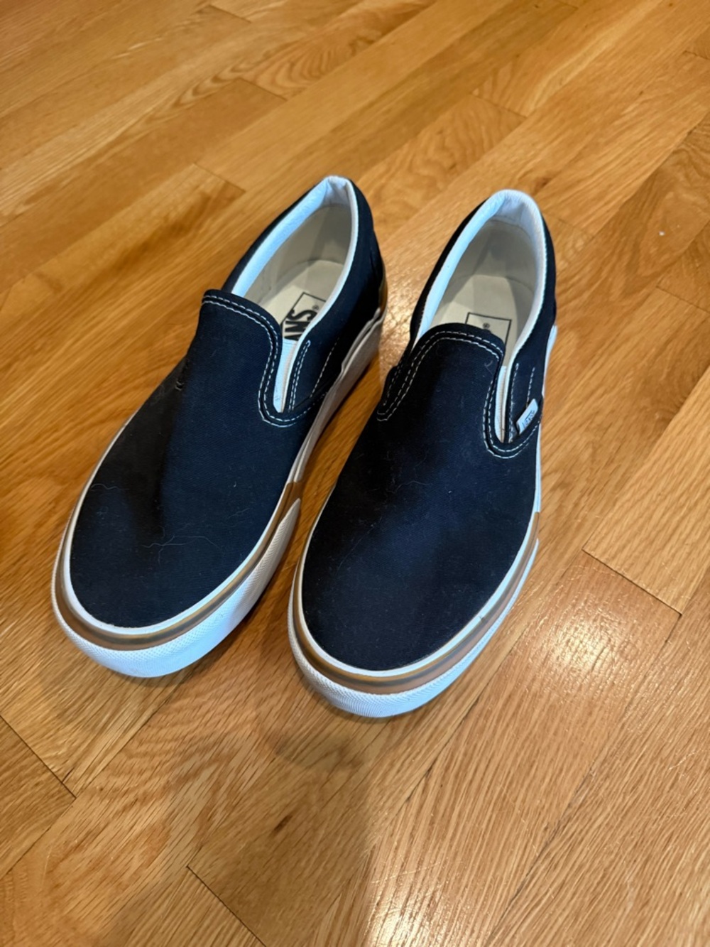 Vans Black Canvas Slip-On Stacked
